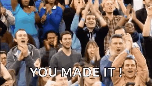 A Crowd Of People Applauding With The Words " You Made It " Written On The Bottom GIF