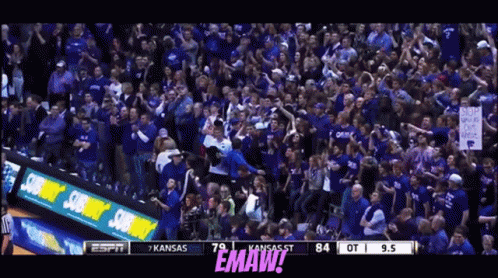 A Crowd Of People Are Watching A Basketball Game And The Scoreboard Says Kansas St 84 Ot 9.5 GIF