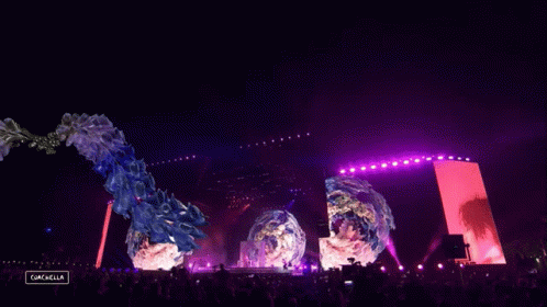 A Crowd Of People At A Music Festival With A Sign That Says Gazelle GIF