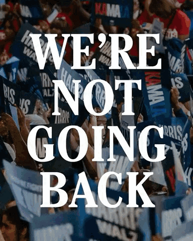 A Crowd Of People Holding Signs With The Words We 'Re Not Going Back GIF