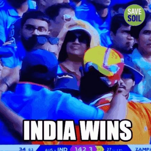 A Crowd Of People Watching A Cricket Game With The Words India Wins Above Them GIF