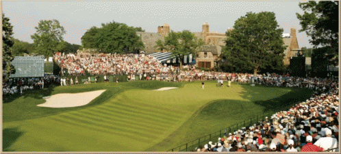 A Crowd Of People Watching A Golf Course With A Scoreboard In The Background GIF
