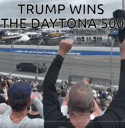 a crowd of people watching a race with the words trump wins the daytona 500