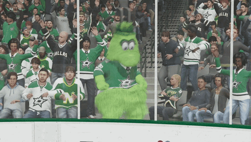 A Crowd Of People Wearing Dallas Jerseys Are Watching A Game GIF