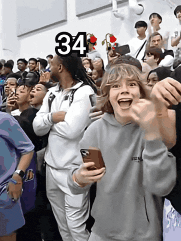 a crowd of people with the number 34 on the top of them
