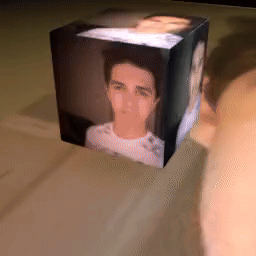 A Cube With A Picture Of A Man In It GIF