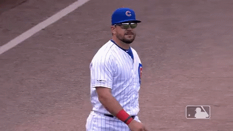 A Cubs Baseball Player Wearing Sunglasses And A Blue Hat With A C On It GIF