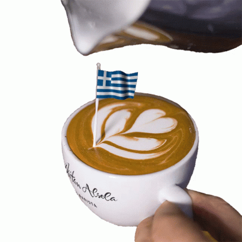 A Cup Of Coffee Has A Greek Flag On Top Of It GIF