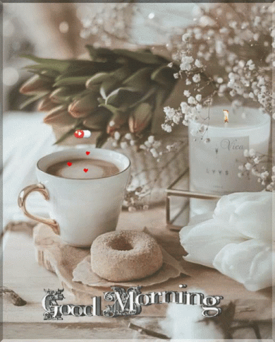 A Cup Of Coffee Next To A Donut And A Candle With The Words Good Morning GIF