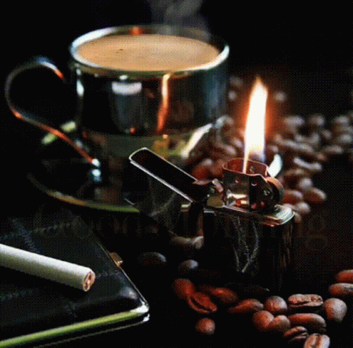 A Cup Of Coffee Next To A Lighter And A Cigarette With The Words Good Morning On The Bottom GIF
