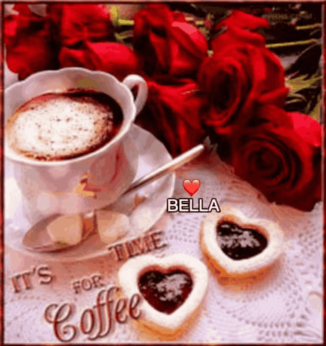 A Cup Of Coffee With A Heart Shaped Cookie Next To Roses GIF