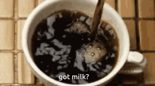 A Cup Of Coffee With The Words Got Milk Written On The Side GIF