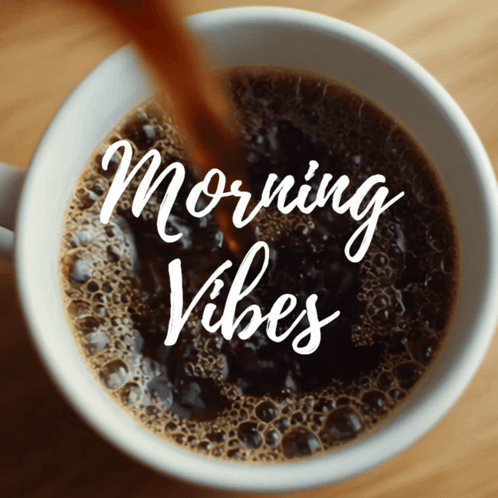 a cup of coffee with the words morning vibes on the bottom