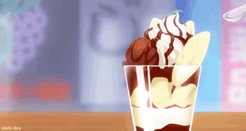 A Cup Of Ice Cream With Whipped Cream , Banana Slices And Chocolate Sauce On A Table . GIF