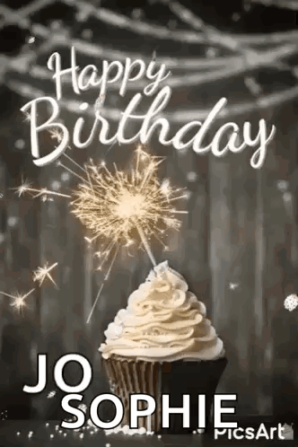 A Cupcake With Whipped Cream And Sparklers On Top Of It . GIF