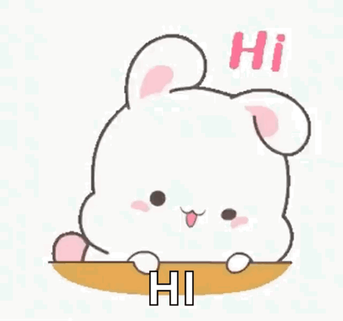 A Cute Cartoon Rabbit Is Sitting On A Table And Saying Hi . GIF