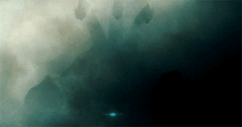 A Dark Background With A Few Trees In The Background GIF