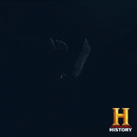 a dark background with the letter v and the word history