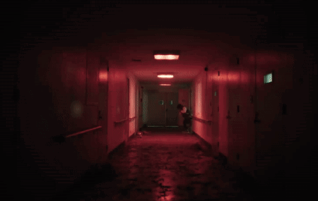 A Dark Hallway With Red Lights And A Door That Says 1 On It GIF