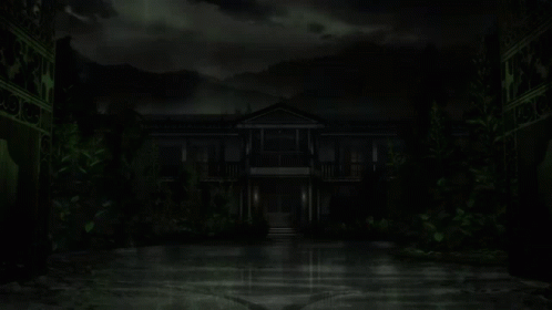 A Dark House With Green Leaves On The Ground And Mountains In The Background GIF