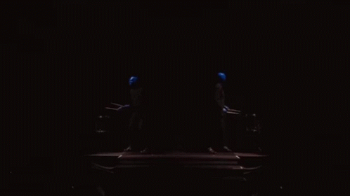 A Dark Room With A Blue Light Coming Out Of The Corner GIF