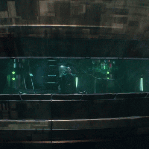 A Dark Room With A Green Light Coming Out Of The Window GIF