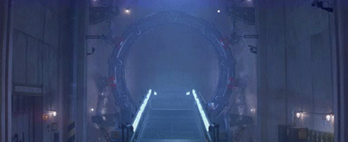 A Dark Room With A Light Coming Out Of A Hole In The Wall GIF