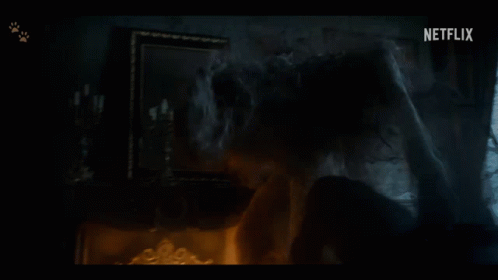 a dark room with a netflix logo on the bottom left