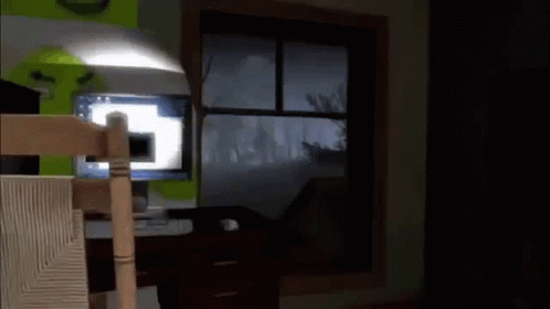 A Dark Room With A Window And A Lamp GIF