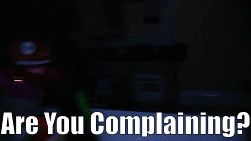 A Dark Room With The Words " Are You Complaining " On The Bottom GIF