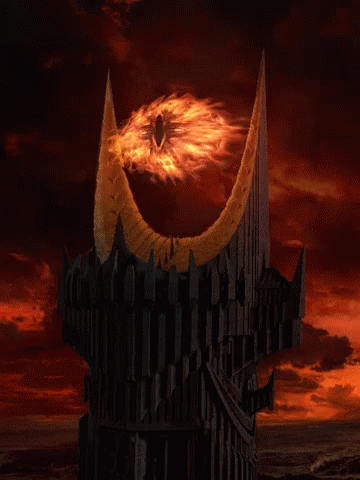 A Dark Tower With A Glowing Eye On Top GIF