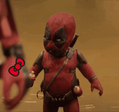 A Deadpool Doll Is Holding A Hello Kitty Bow GIF