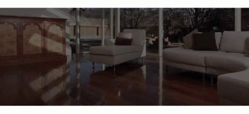 A Deck With A Couch And Two Chairs On It GIF