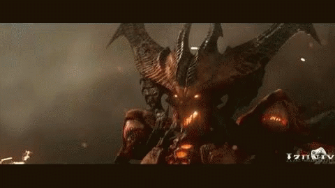 A Demon With Horns And Wings Is Standing In The Dark Looking At The Camera . GIF