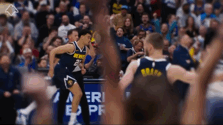 A Denver Basketball Player Celebrates With His Teammates During A Game GIF