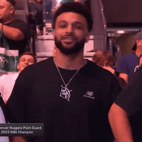 A Denver Nuggets Point Guard Is Wearing A Black Shirt GIF