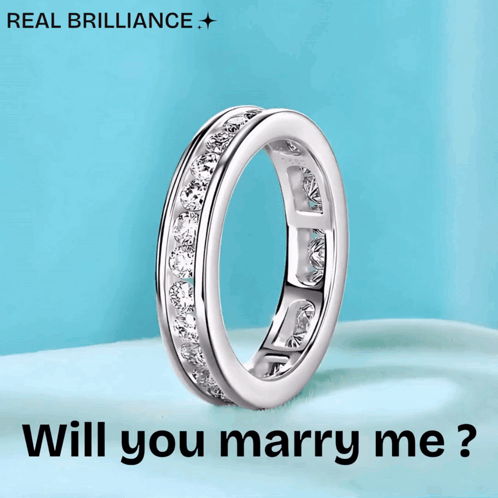 a diamond ring with the words " will you marry me " below it