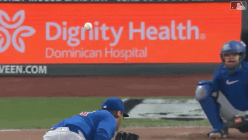 A Dignity Health Ad Is Behind A Baseball Player GIF