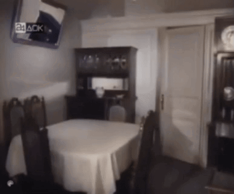 A Dining Room With A Table And Chairs And A Mirror That Says 24 Aok GIF