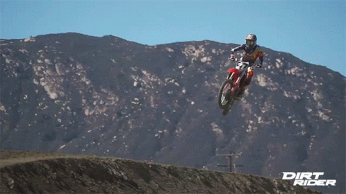 A Dirt Rider Is Jumping In The Air GIF