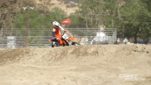 A Dirt Rider Is Riding A Dirt Bike GIF