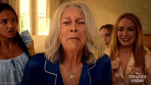 A Disney Freakier Friday Advertisement Features A Woman In A Blue Pajamas GIF