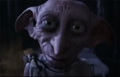 A Dobby From Harry Potter Says Hello In The Dark GIF