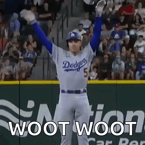 A Dodgers Baseball Player Is Standing On The Field With His Arms In The Air And The Words Woot Woot Behind Him . GIF