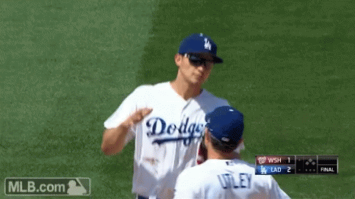 A Dodgers Baseball Player Is Talking To Another Player GIF