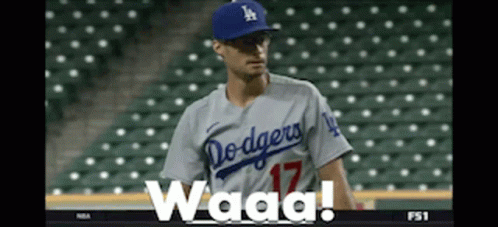 A Dodgers Baseball Player Wearing A Number 17 Jersey Stands On The Field GIF