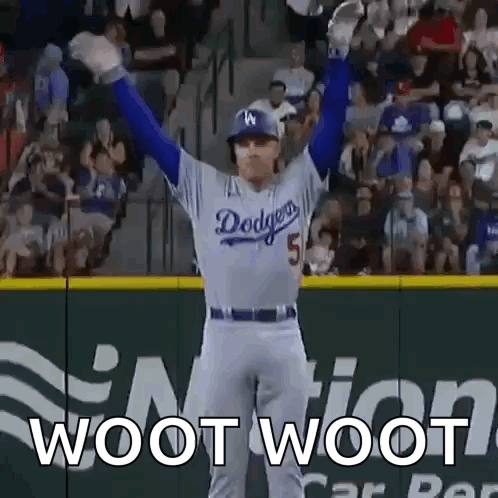 A Dodgers Baseball Player With His Arms In The Air GIF