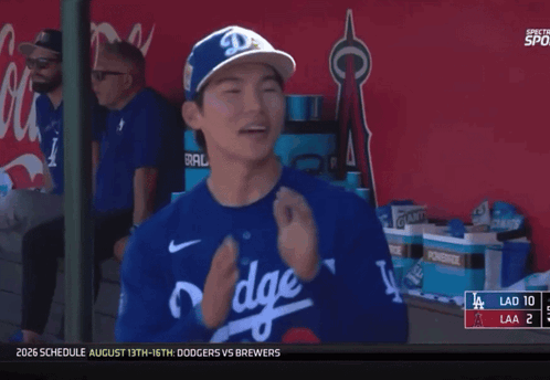 A Dodgers Player Is Smiling In The Dugout GIF