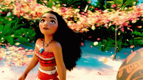 A Doll From The Movie Moana Is Standing In Front Of A Lush Green Forest . GIF
