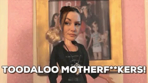 A Doll Is Standing In Front Of A Painting And Says `` Toodaloo Motherf**kers '' . GIF